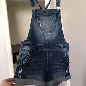 Women’s partially distressed short overalls